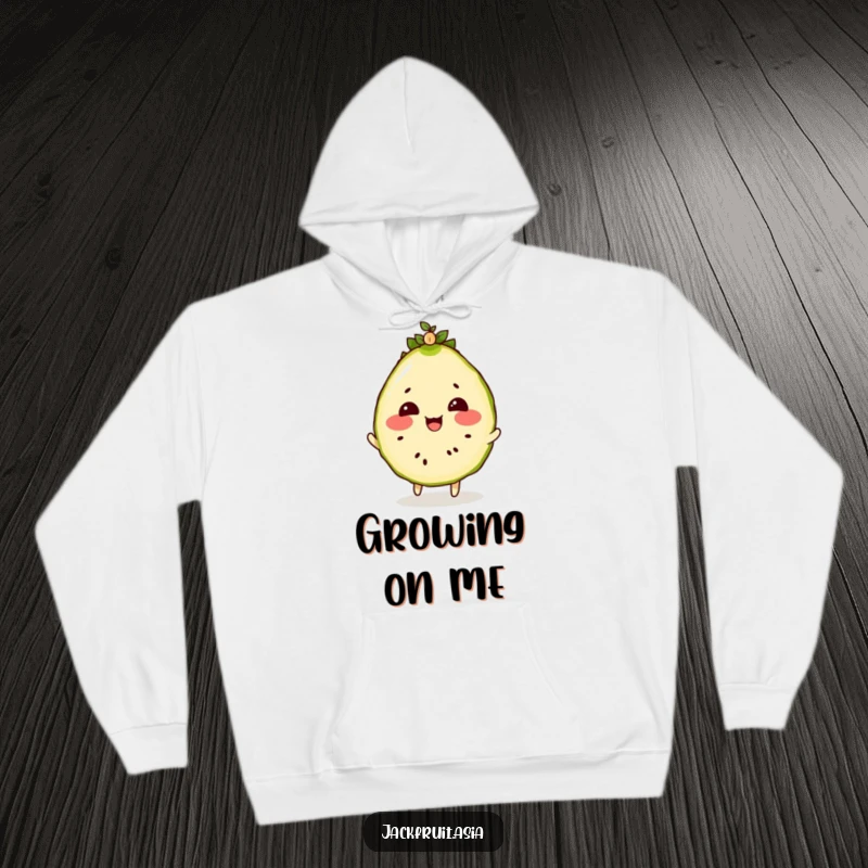 Funny hoodie featuring a jackfruit slice with rosy cheeks, engaged in the playful act of bouncing a tiny seedling.